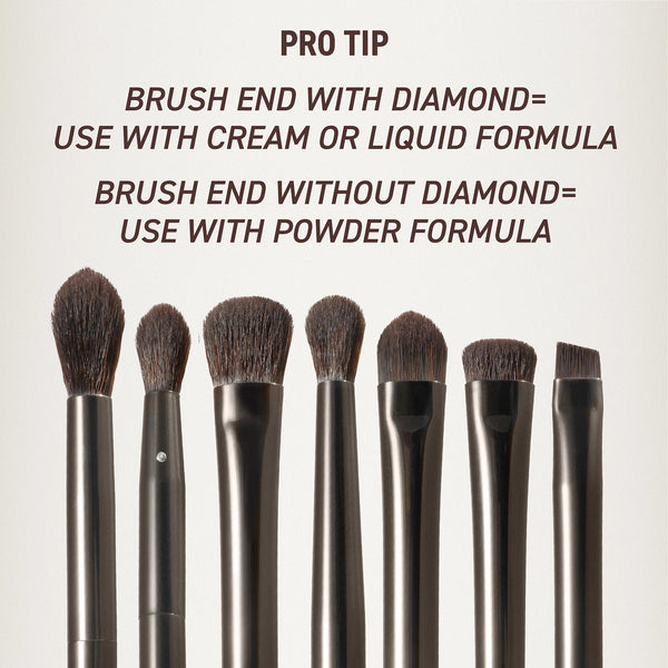 Makeup brush set brush heads close-up, rounded bristles on silver-gray handles.
