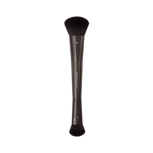 Makeup brush with short black bristles and a dark straight handle.