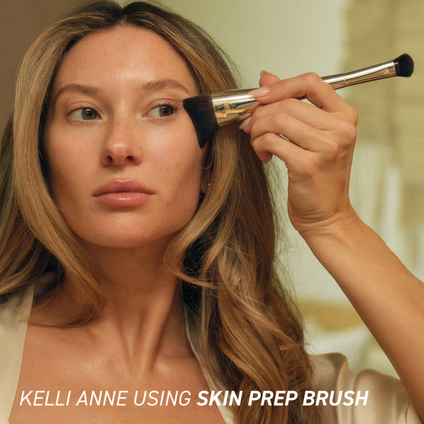 Makeup brush being used on face, applying product to the cheek area